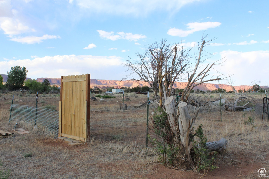 View of yard featuring a view of countryside and a mountain view