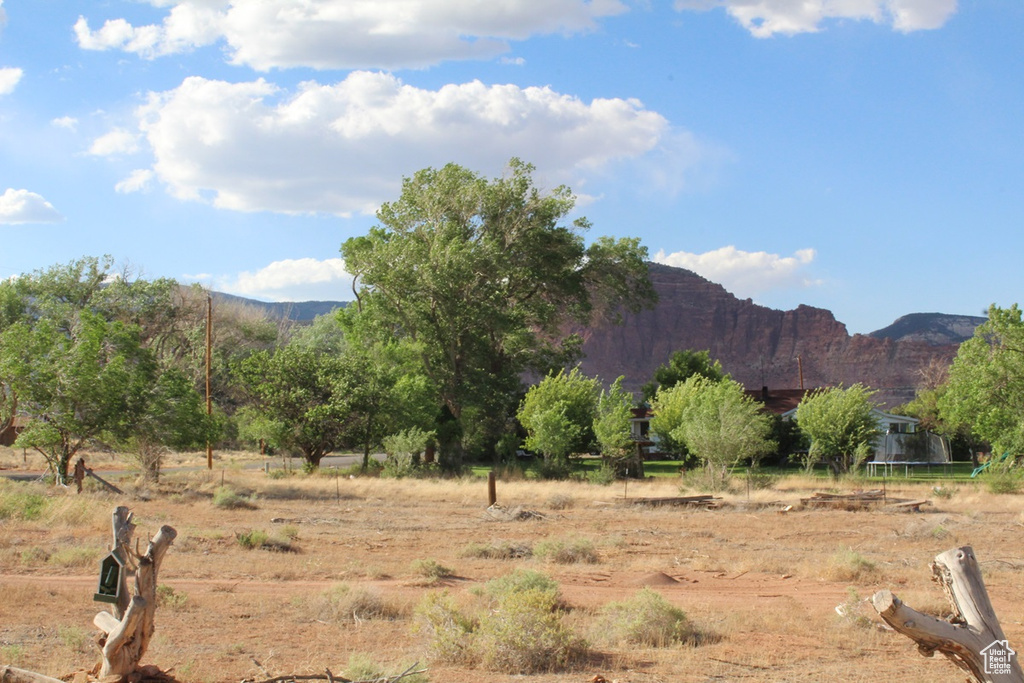 View of mountain backdrop featuring rural landscape