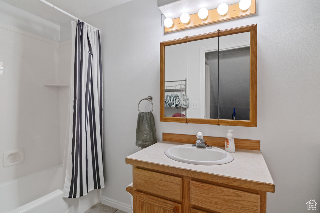 Full bathroom with vanity and shower / tub combo