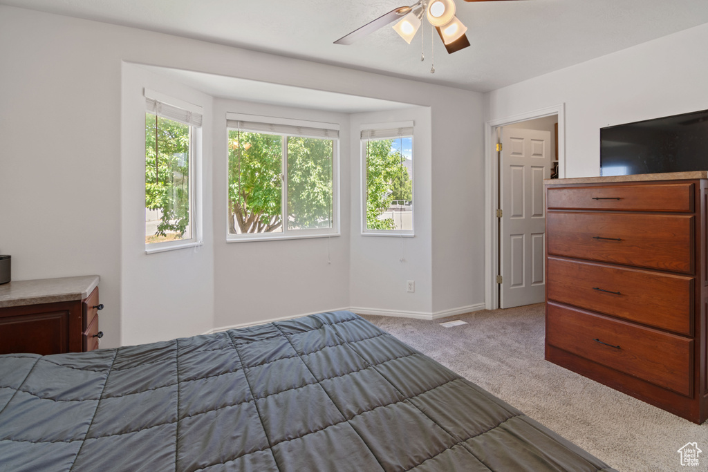 Bedroom featuring carpet flooring and ceiling fan