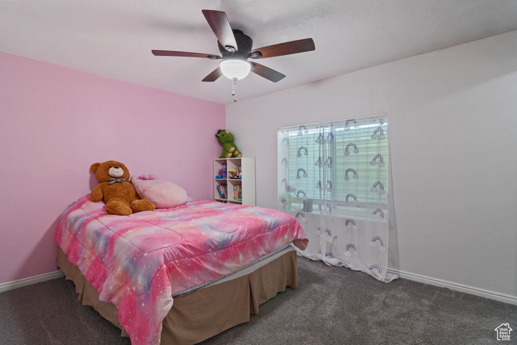 Bedroom with carpet and ceiling fan