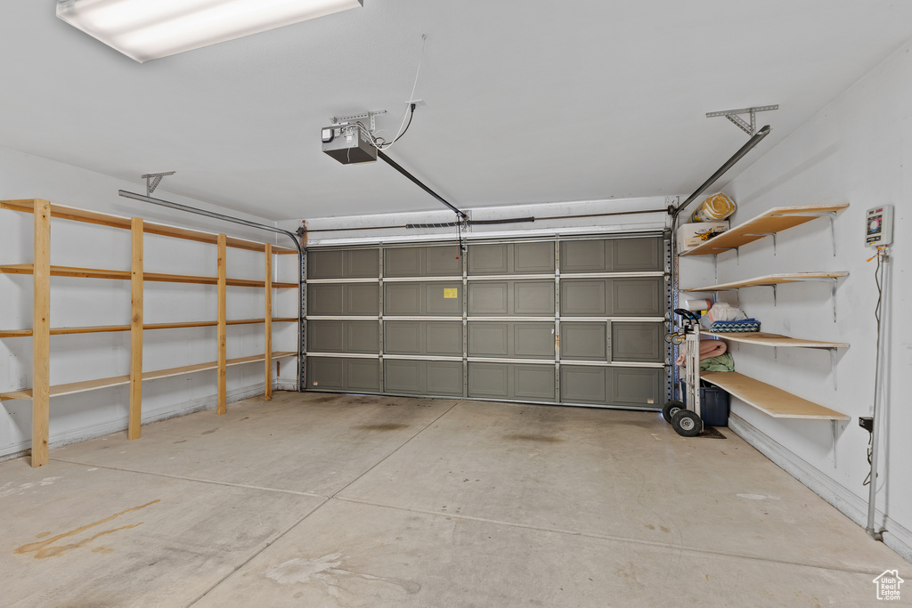 Garage featuring a garage door opener