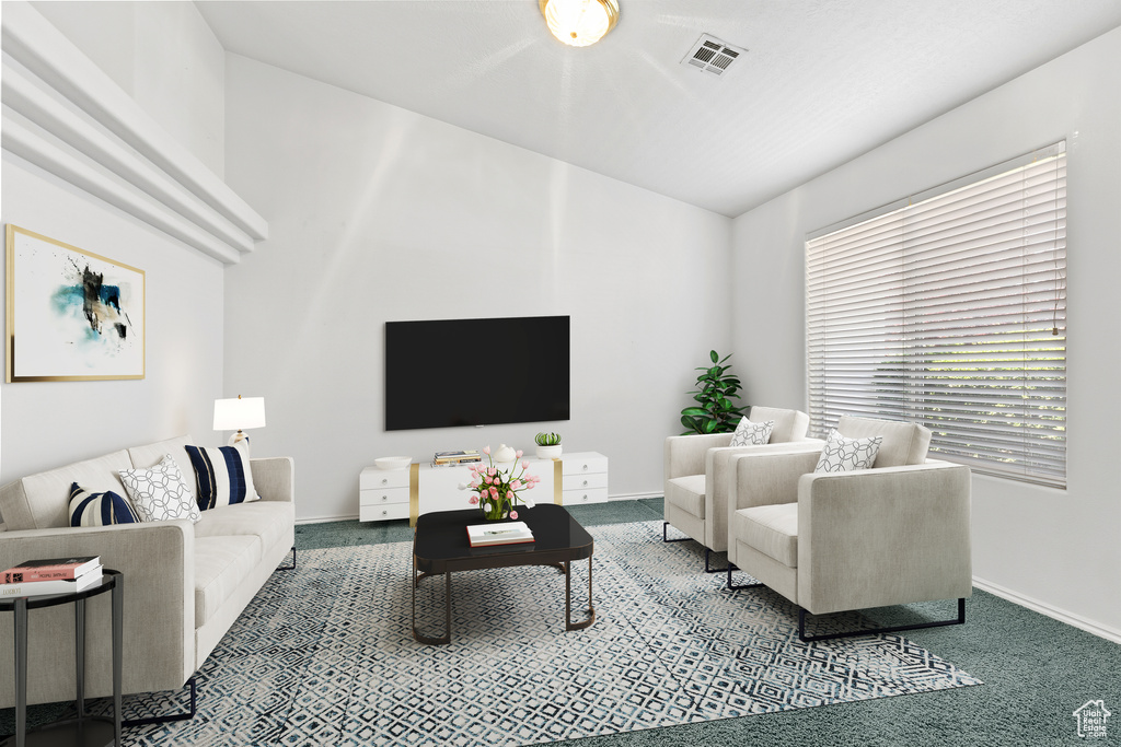 Carpeted living area with baseboards and vaulted ceiling