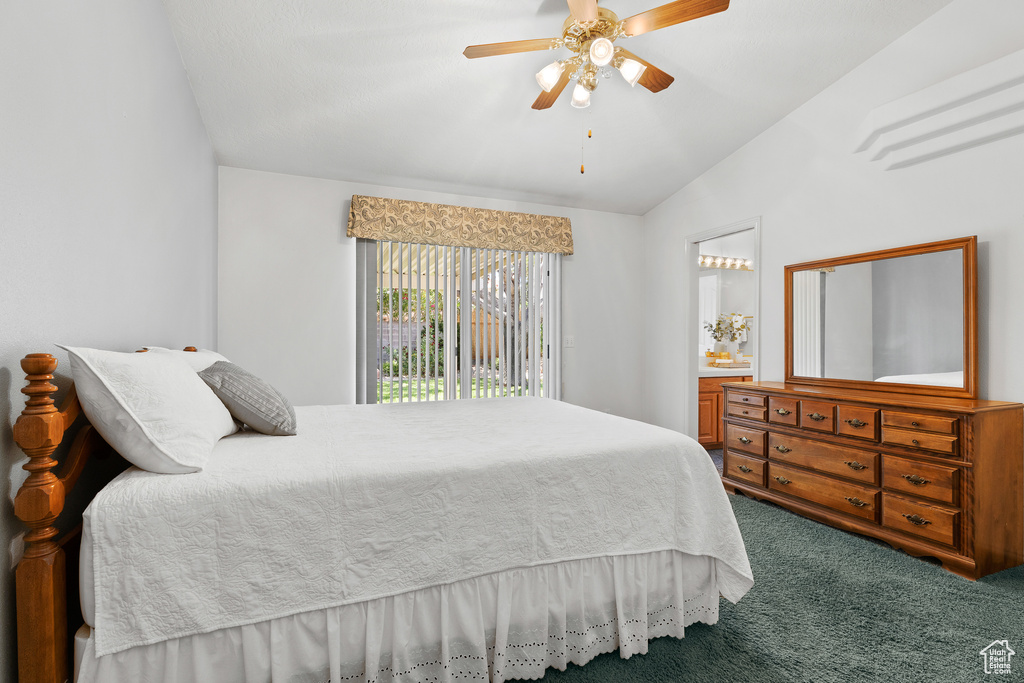 Bedroom with carpet floors, vaulted ceiling, ceiling fan, and access to outside