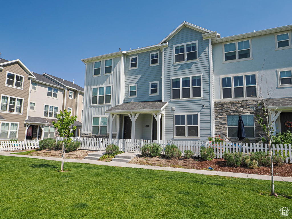 Multi unit property featuring a porch and board and batten siding