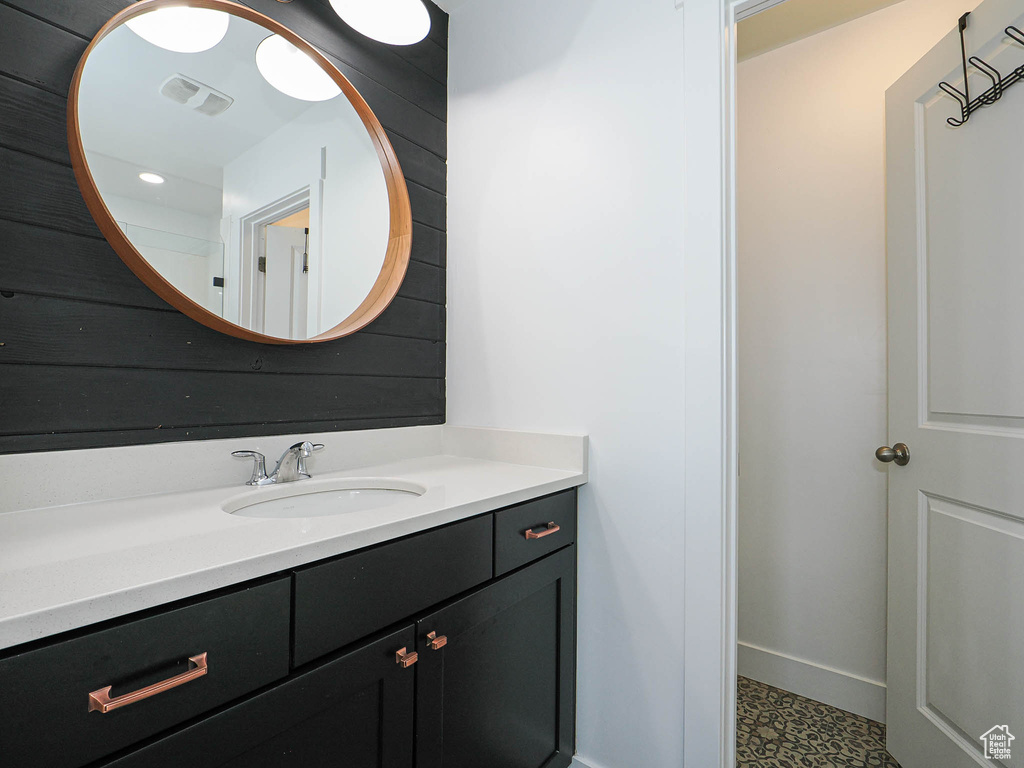 Bathroom featuring vanity and baseboards