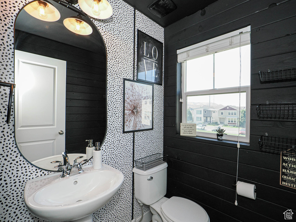 Bathroom with wood walls