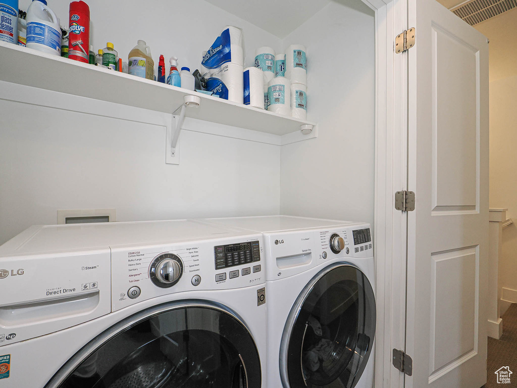 Laundry room featuring independent washer and dryer