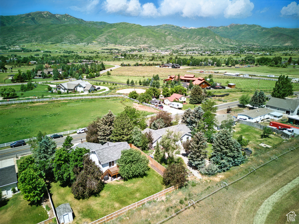 Aerial view of sparsely populated area with a mountain backdrop