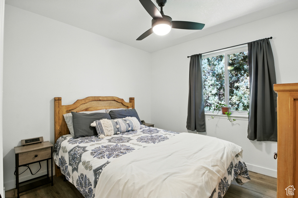Bedroom with wood finished floors and a ceiling fan