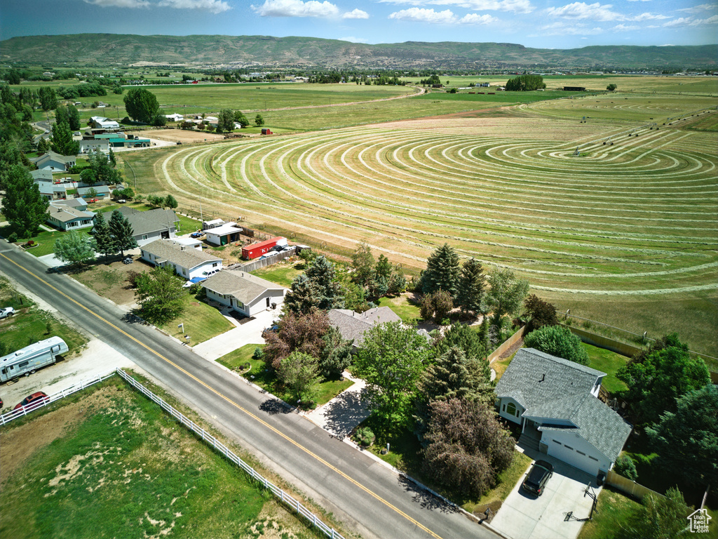 Aerial view of sparsely populated area with a mountain backdrop