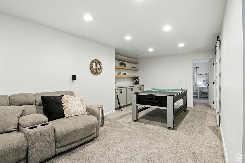 Game room with light colored carpet and recessed lighting