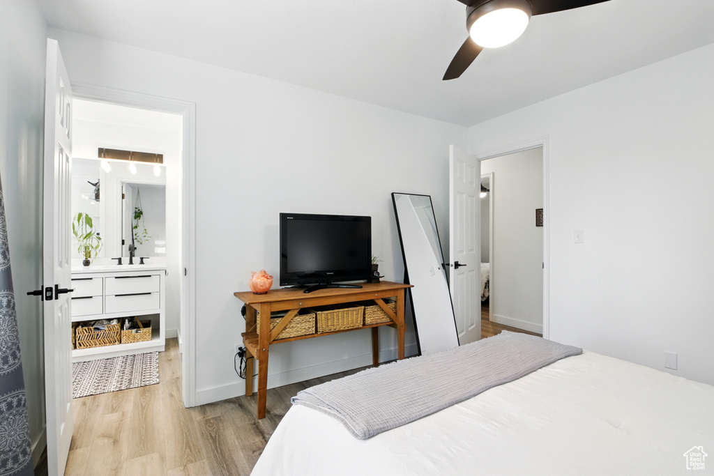 Bedroom featuring light wood-style floors and ceiling fan