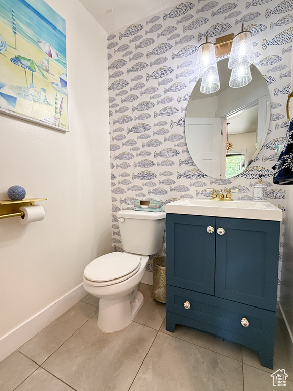 Bathroom with tile patterned floors and vanity