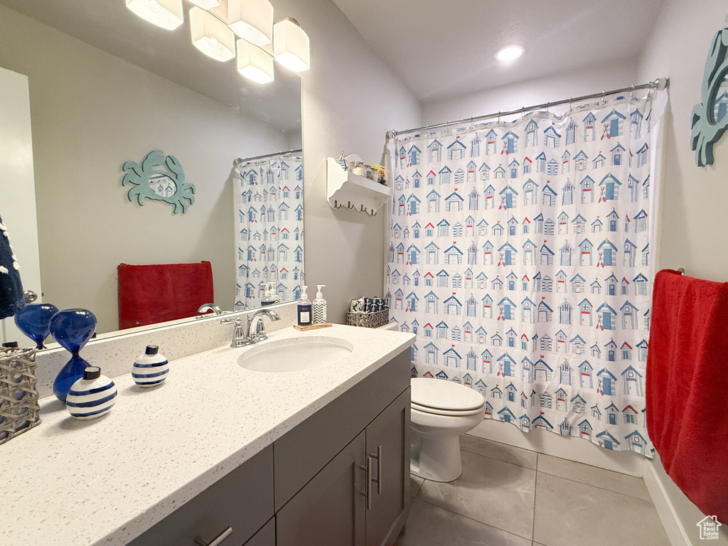 Bathroom featuring vanity, tile patterned flooring, a shower with curtain, and recessed lighting
