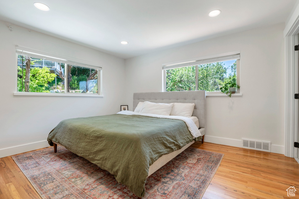 Bedroom featuring wood finished floors and recessed lighting