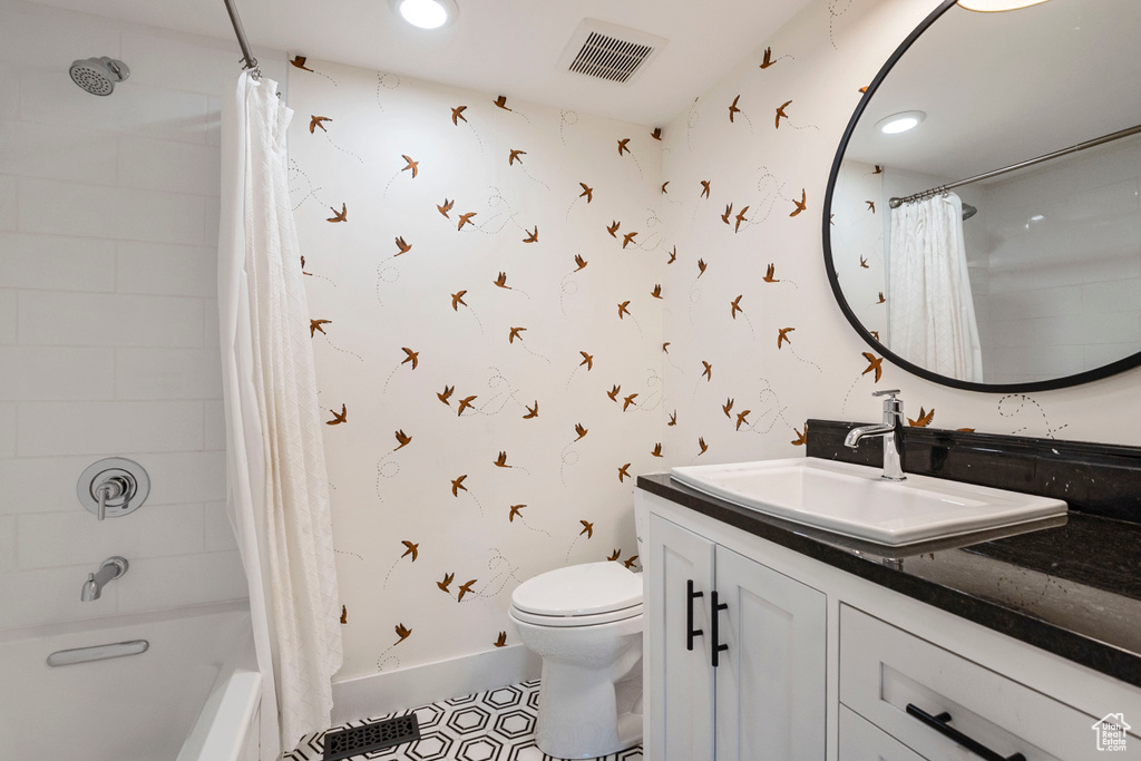 Bathroom with vanity, shower / tub combo with curtain, wallpapered walls, tile patterned flooring, and recessed lighting