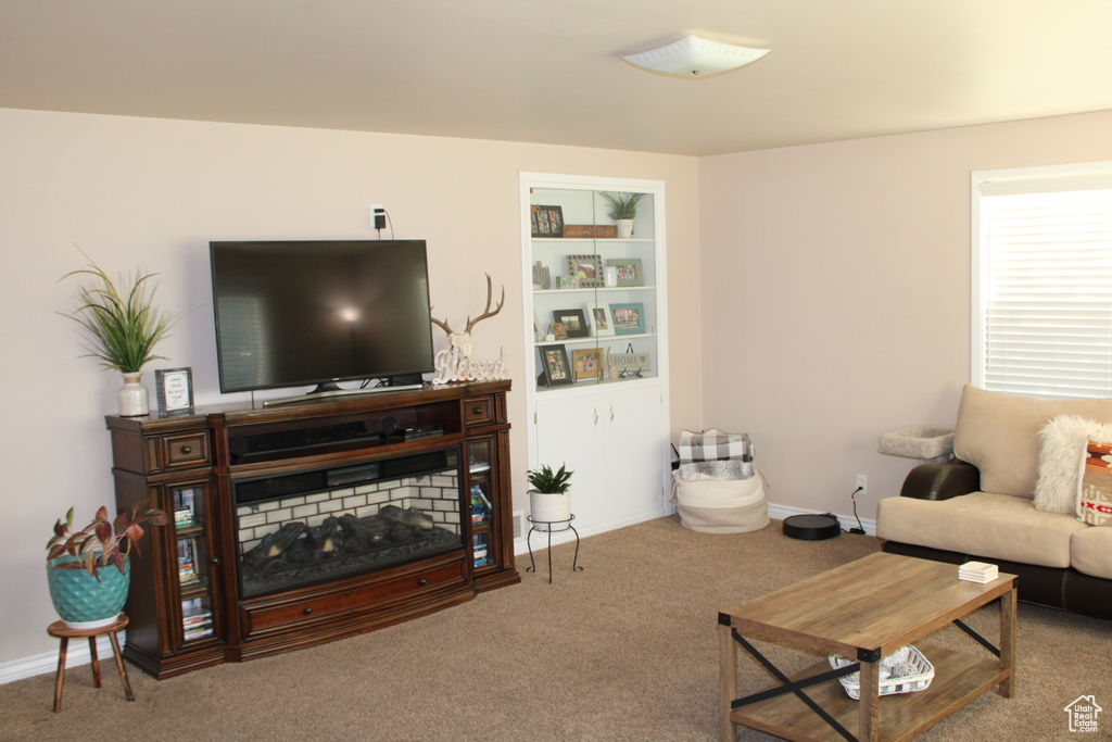 Living room with carpet flooring and baseboards