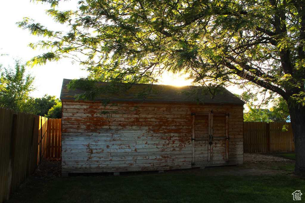 View of shed with a fenced backyard