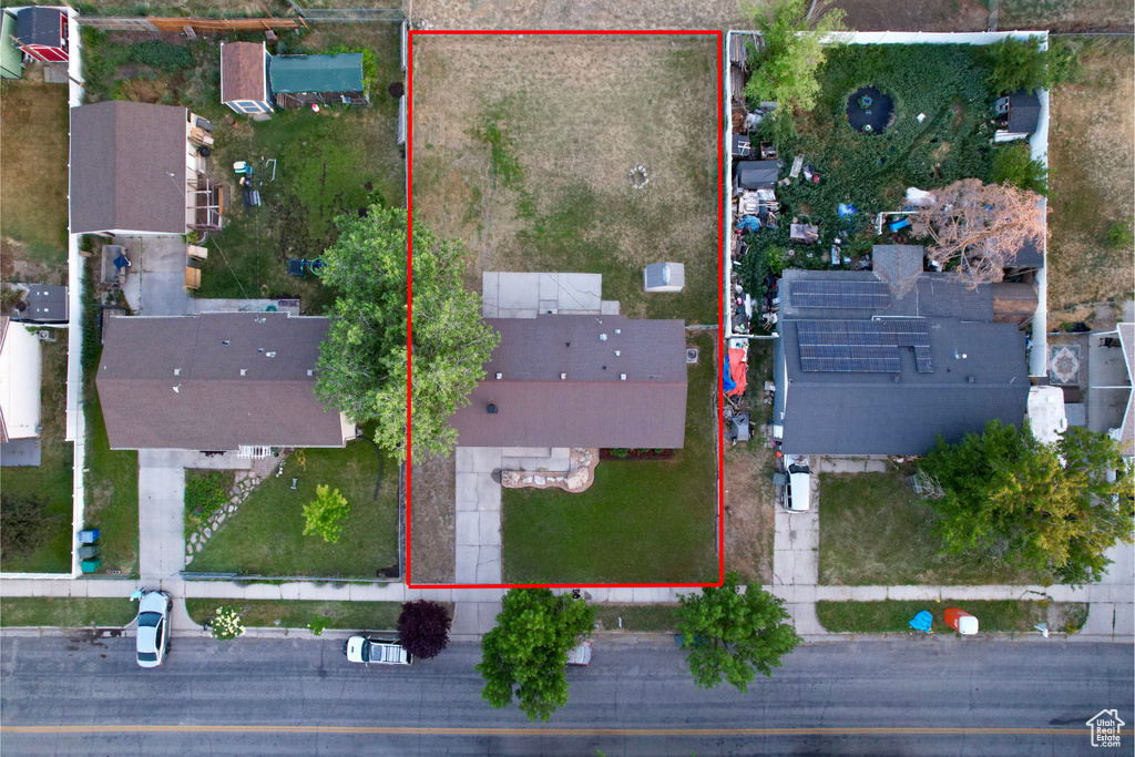 Aerial view of property and surrounding area with property parcel outlined