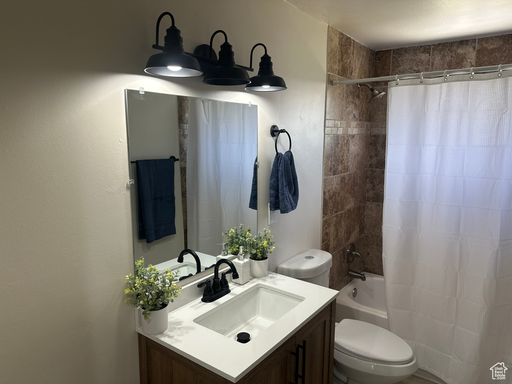 Full bathroom with vanity and shower / tub combo with curtain
