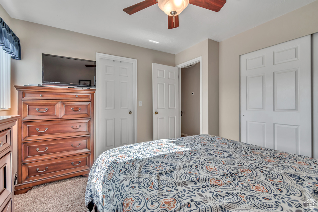 Bedroom with carpet and a ceiling fan