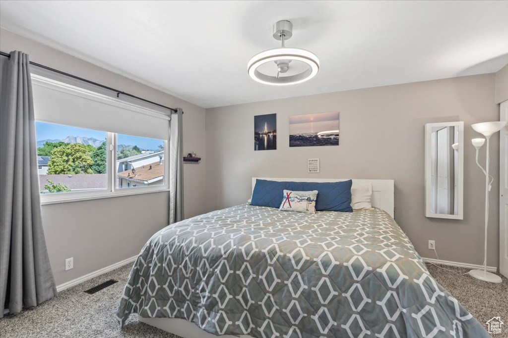 Carpeted bedroom with baseboards