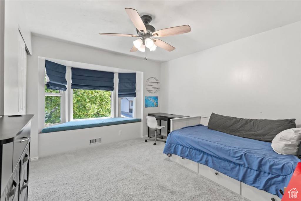 Bedroom with carpet flooring and a ceiling fan