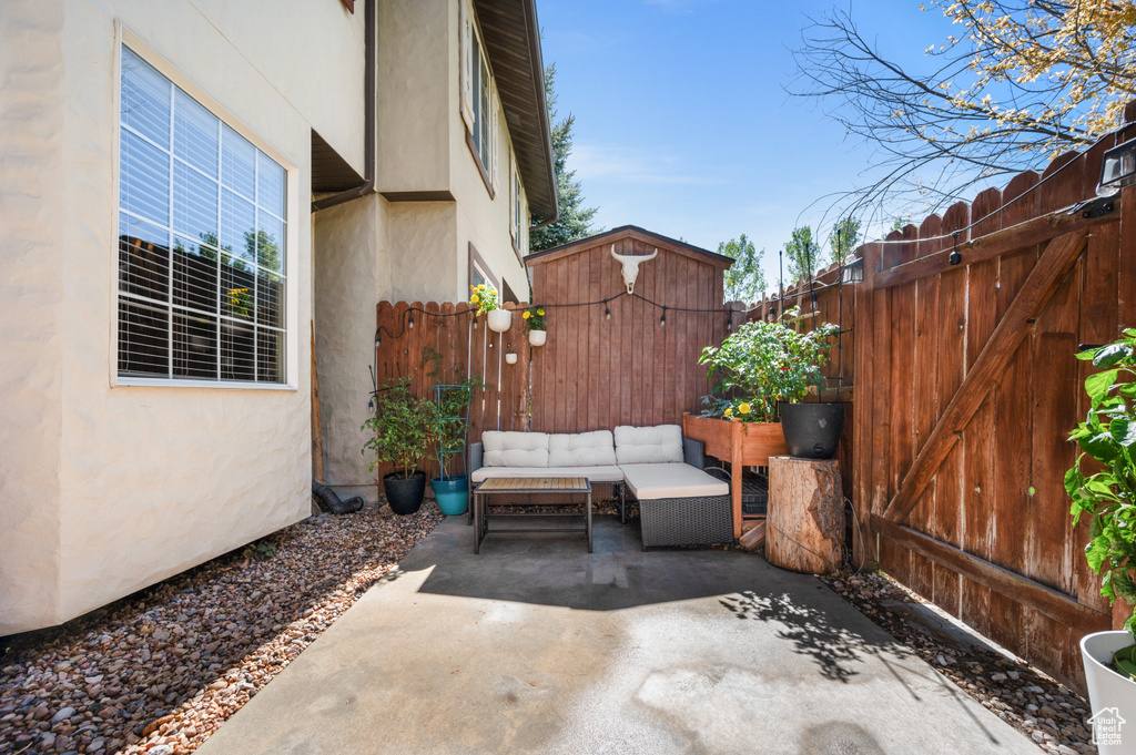 View of patio with an outdoor hangout area