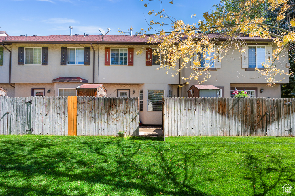 Rear view of property featuring stucco siding