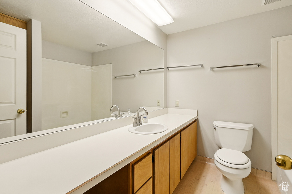Bathroom with toilet and vanity