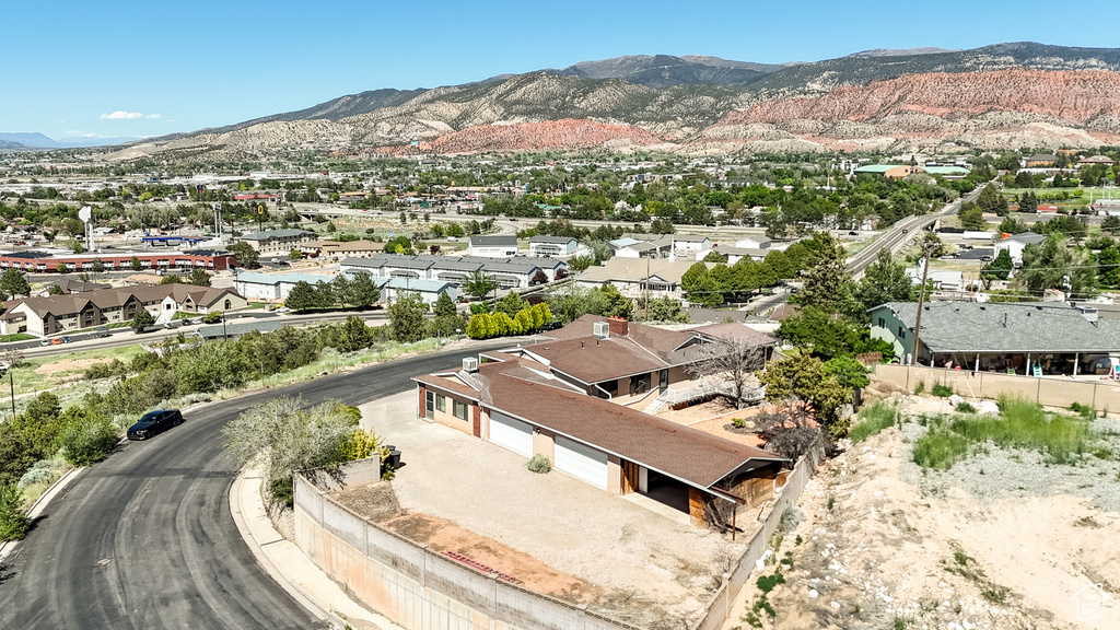 Aerial perspective of suburban area with a mountainous background