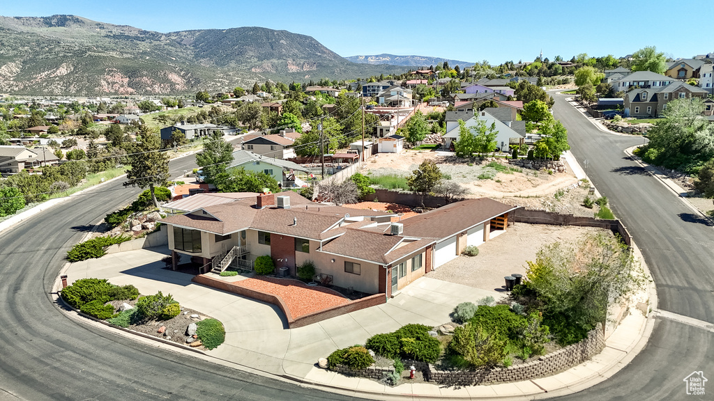 Aerial view of residential area featuring mountains