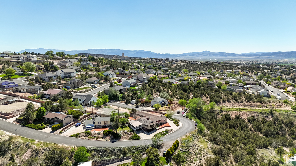 Aerial perspective of suburban area with a mountain backdrop