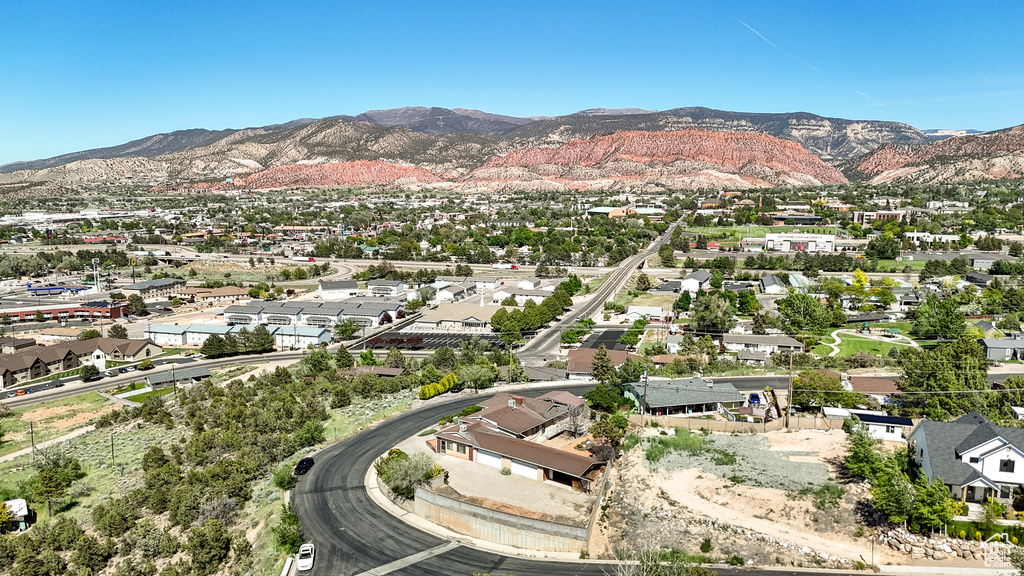 Aerial perspective of suburban area with a mountainous background