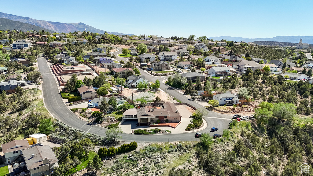 Aerial view of residential area featuring a mountainous background