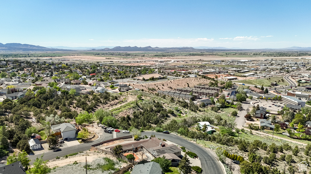 Aerial perspective of suburban area featuring a mountain backdrop