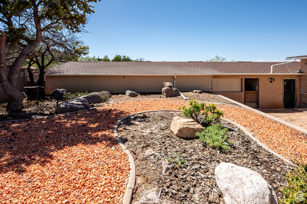 View of home's exterior with a shingled roof