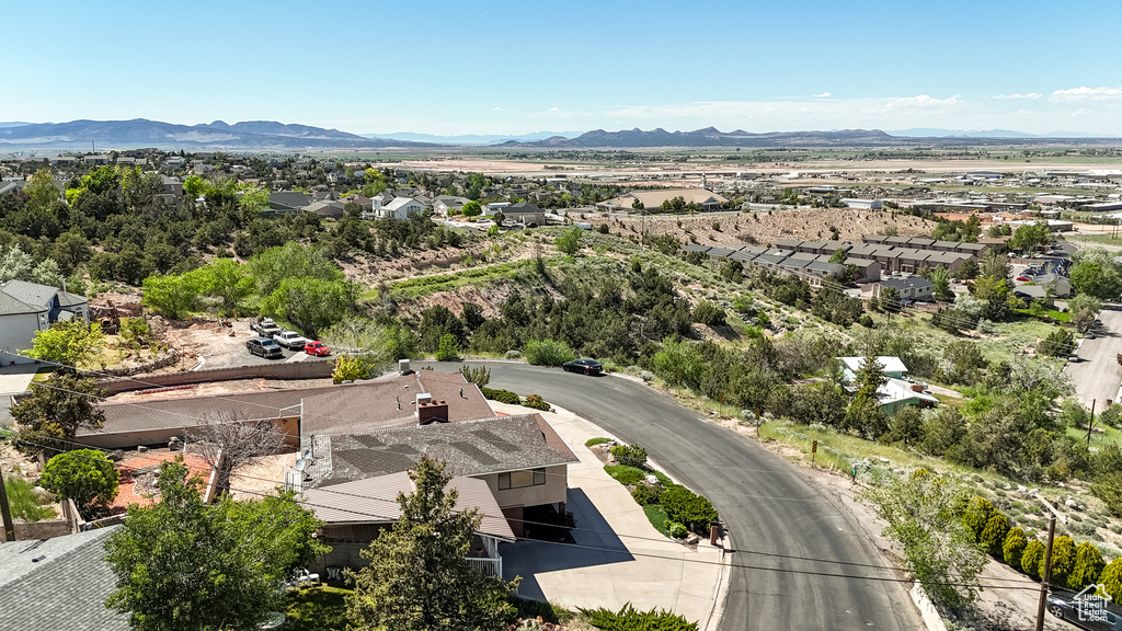 Aerial perspective of suburban area featuring a mountainous background