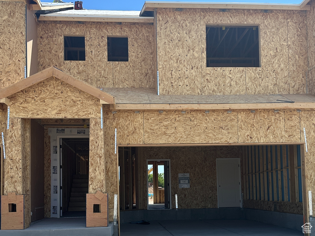Rear view of house with stucco siding