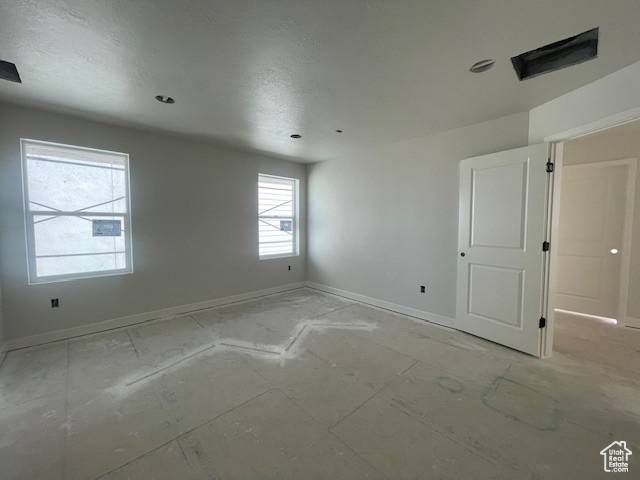 Unfurnished room featuring baseboards