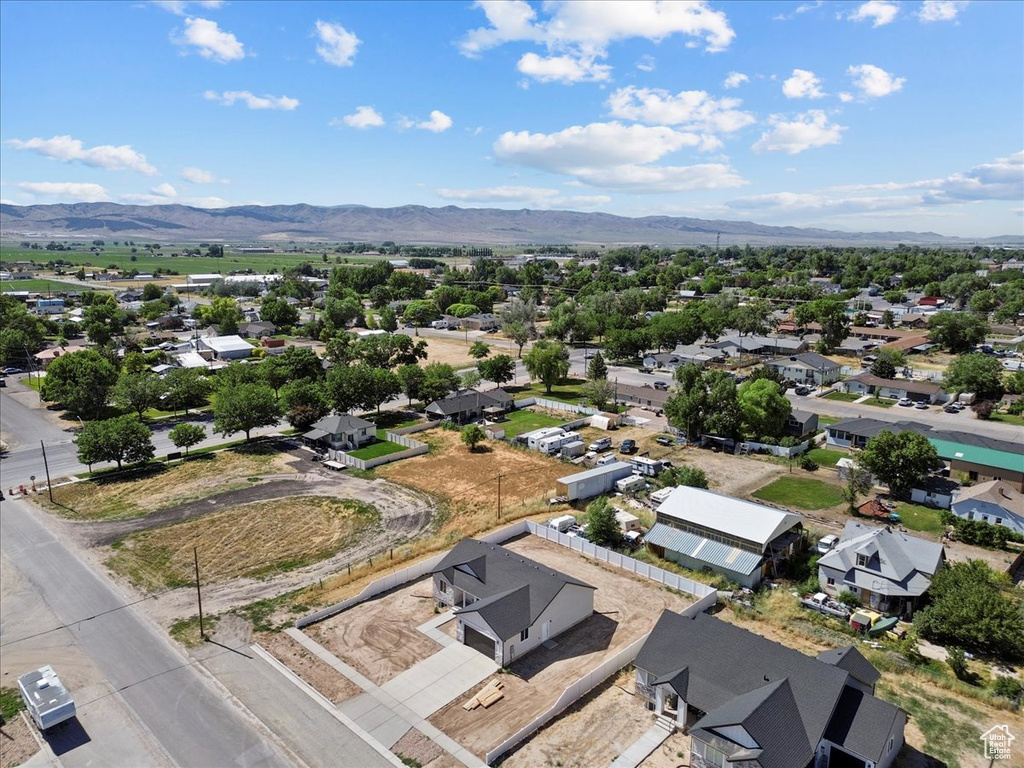 Aerial perspective of suburban area featuring a mountain backdrop