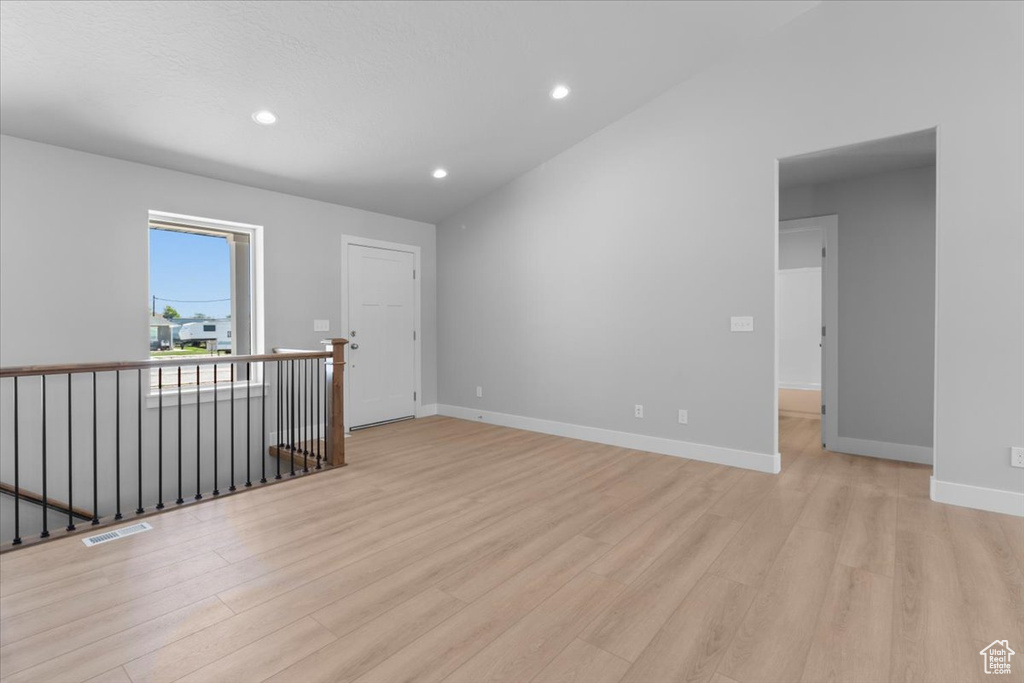 Spare room featuring light wood-style floors and recessed lighting