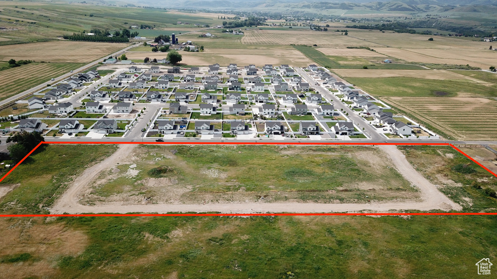 Overview of rural landscape with property parcel outlined and farmland