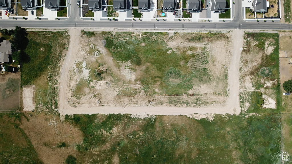 Aerial view of property's location featuring nearby suburban area