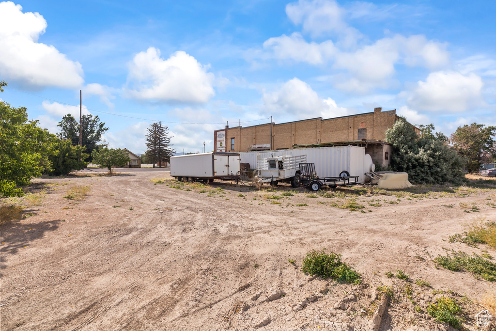 Rear view of property featuring an outbuilding