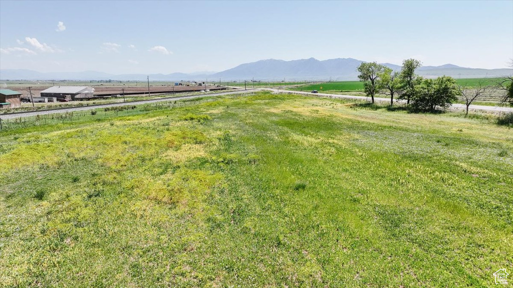 View of yard featuring a view of countryside and a mountain view