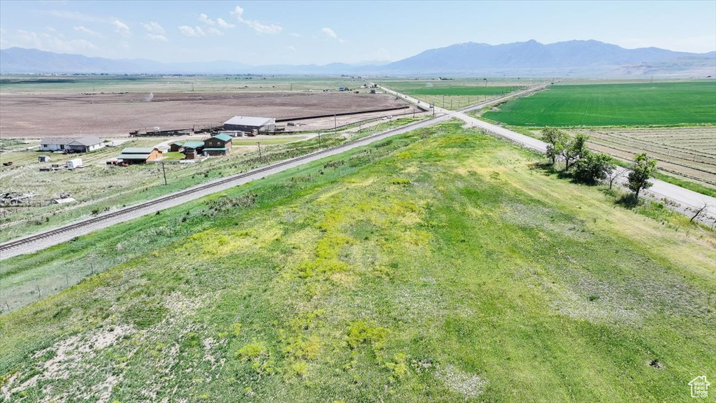 View of rural area with abundant farmland and a mountain backdrop