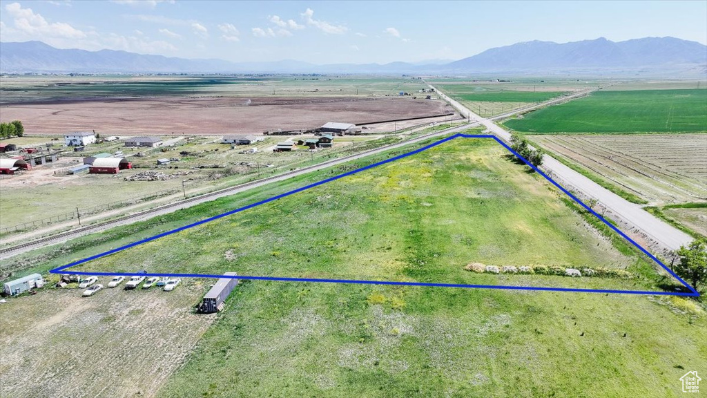 View of rural area featuring property parcel outlined and a mountain backdrop