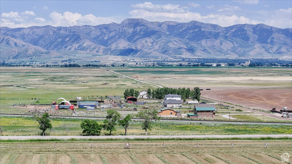 View of mountain background featuring rural landscape